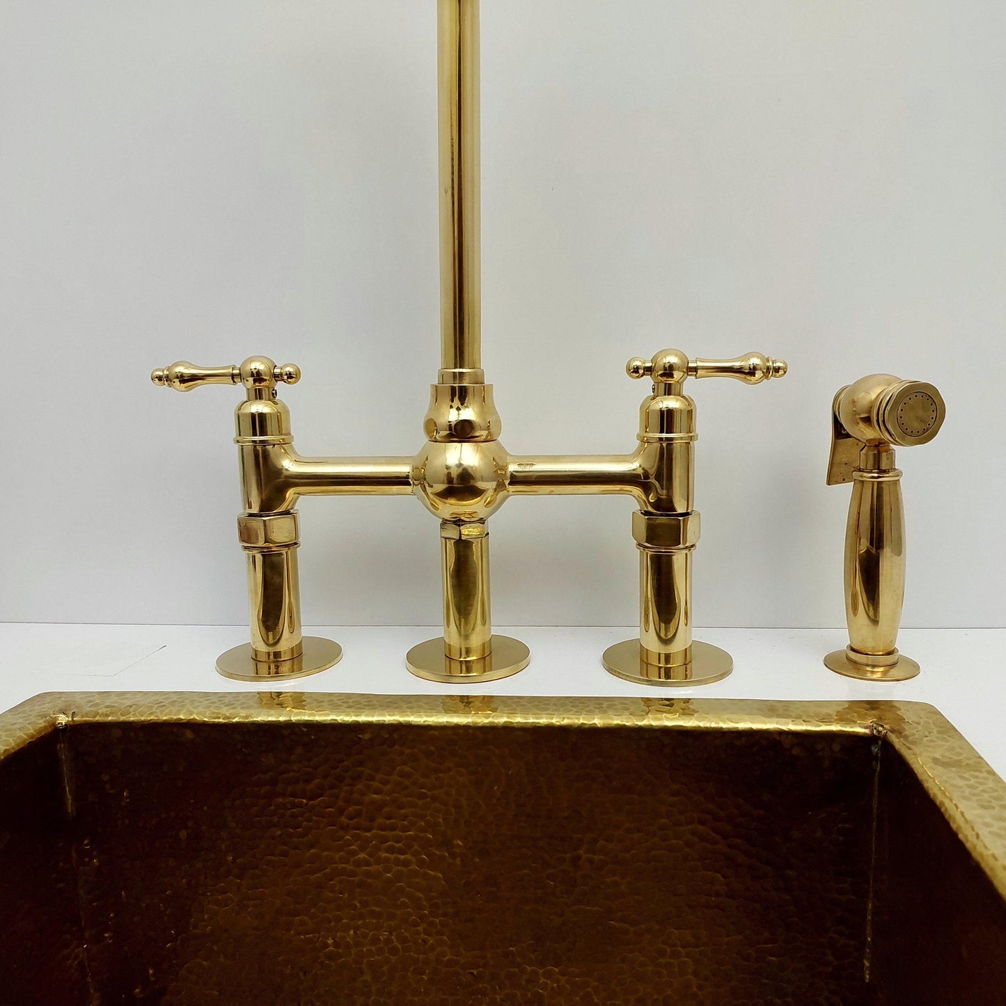 Unlacquered Brass Bridge Kitchen Faucet With Ball Center, 3 Straight Legs, And Sprayer - 8" Spread - Ref: AKC-4