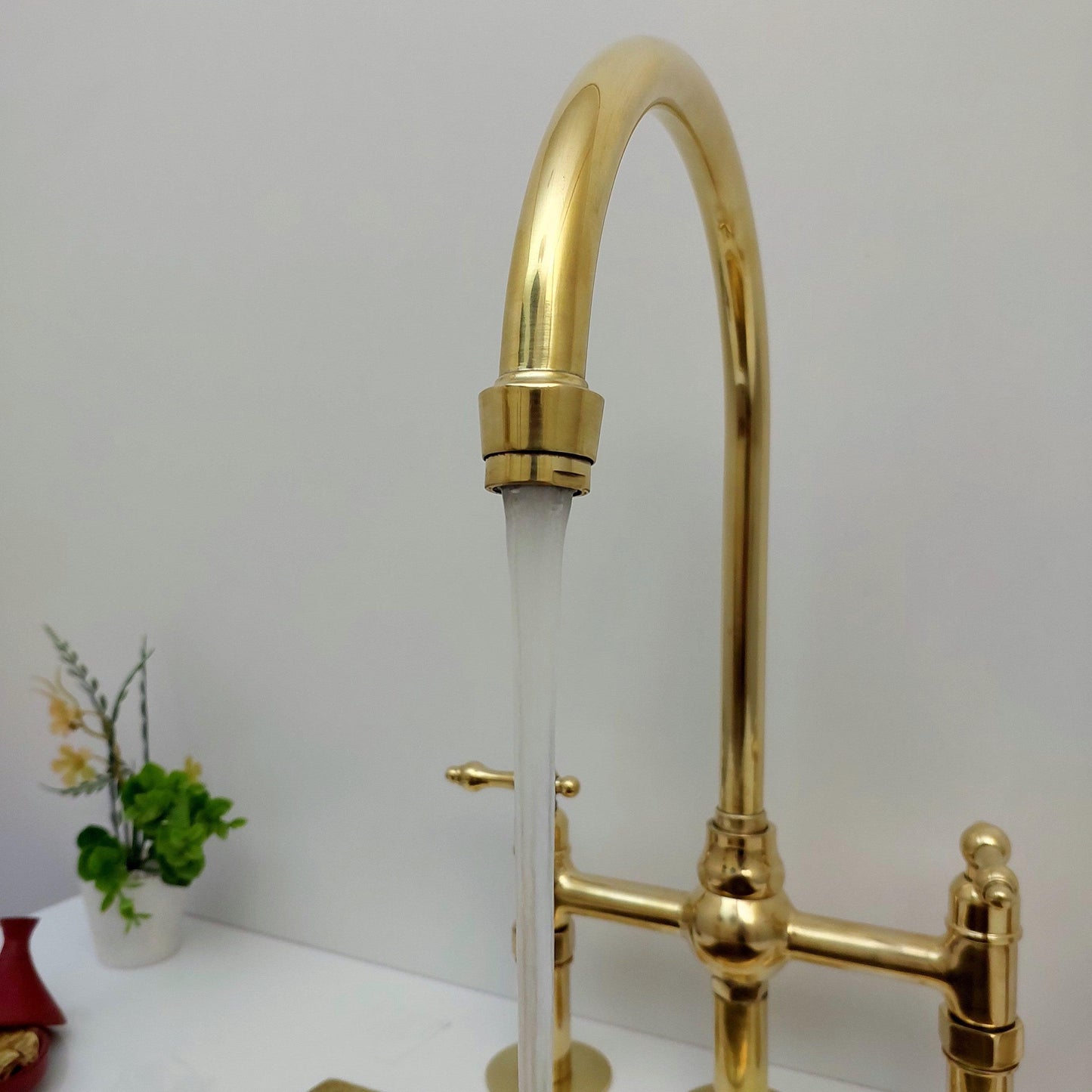 Unlacquered Brass Bridge Kitchen Faucet With Ball Center, 3 Straight Legs, And Sprayer - 8" Spread - Ref: AKC-4