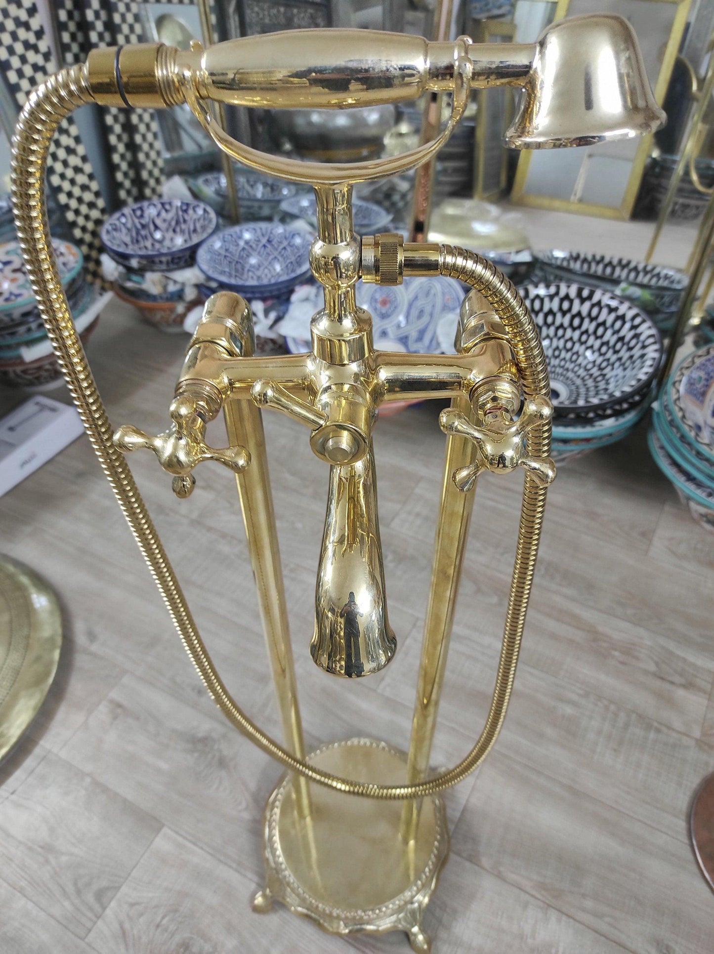 Hand-held, unlacquered brass faucet with solid brass freestanding tub filler