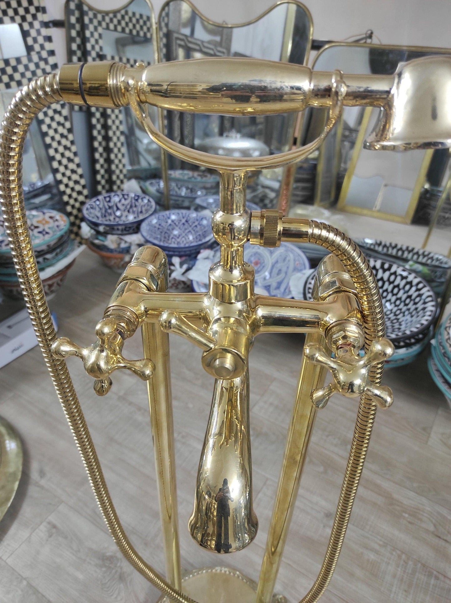 Hand-held, unlacquered brass faucet with solid brass freestanding tub filler