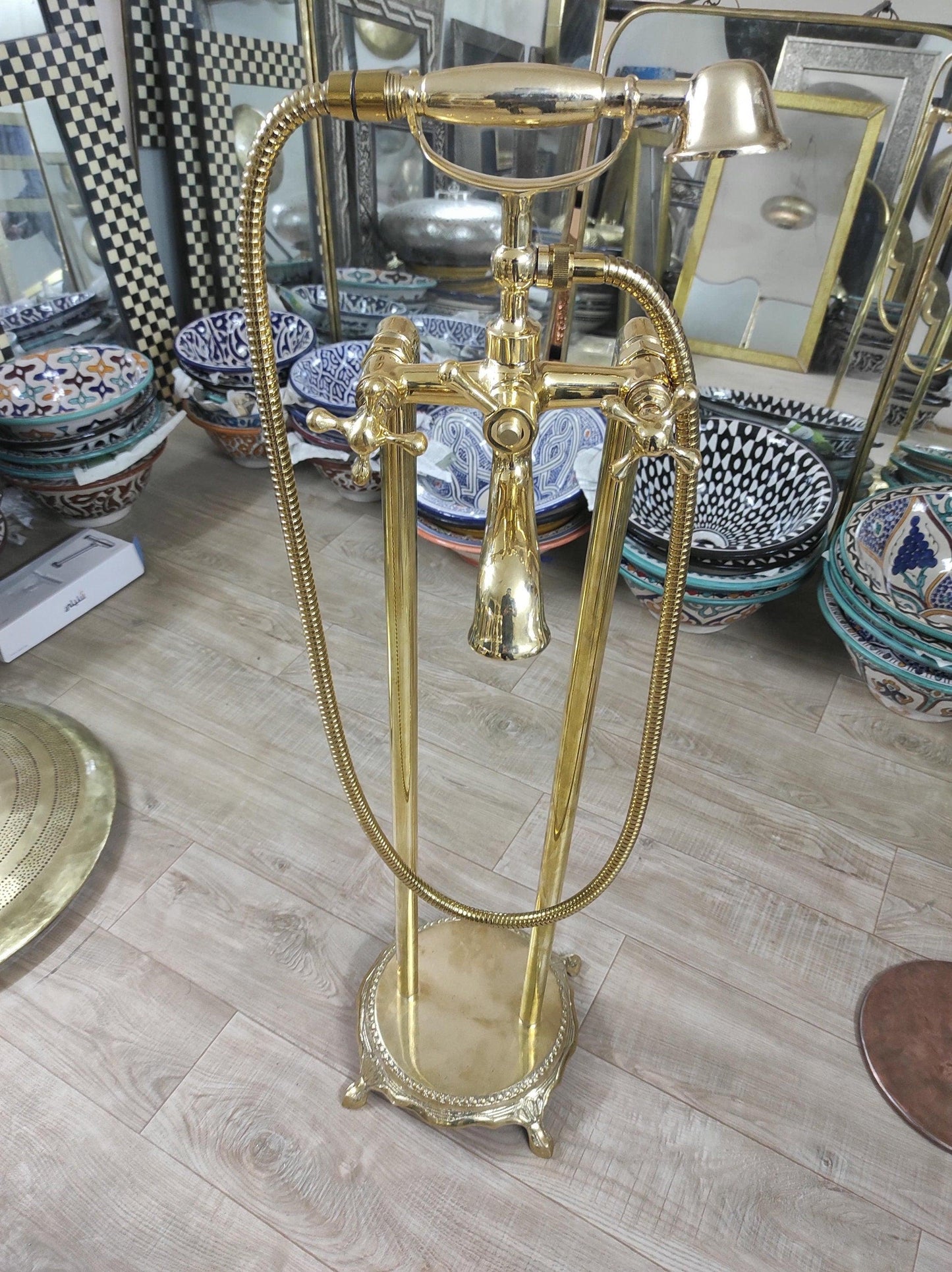 Hand-held, unlacquered brass faucet with solid brass freestanding tub filler