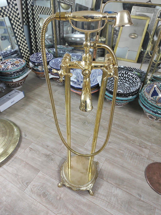 Hand-held, unlacquered brass faucet with solid brass freestanding tub filler