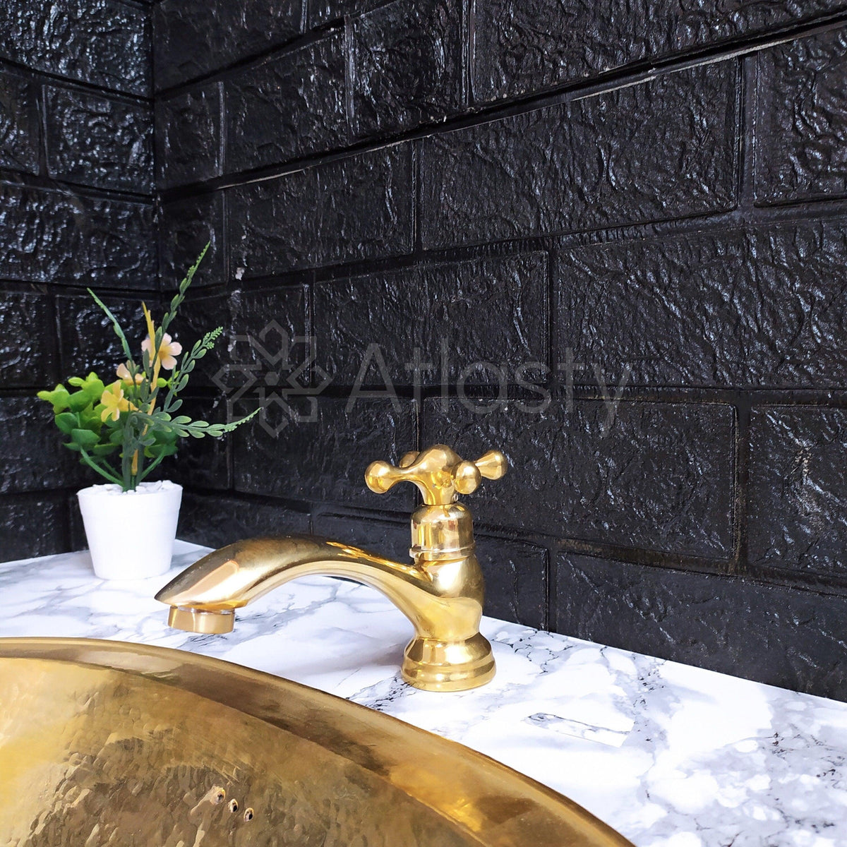 Single-hole unlacquered brass bathroom faucet — front view