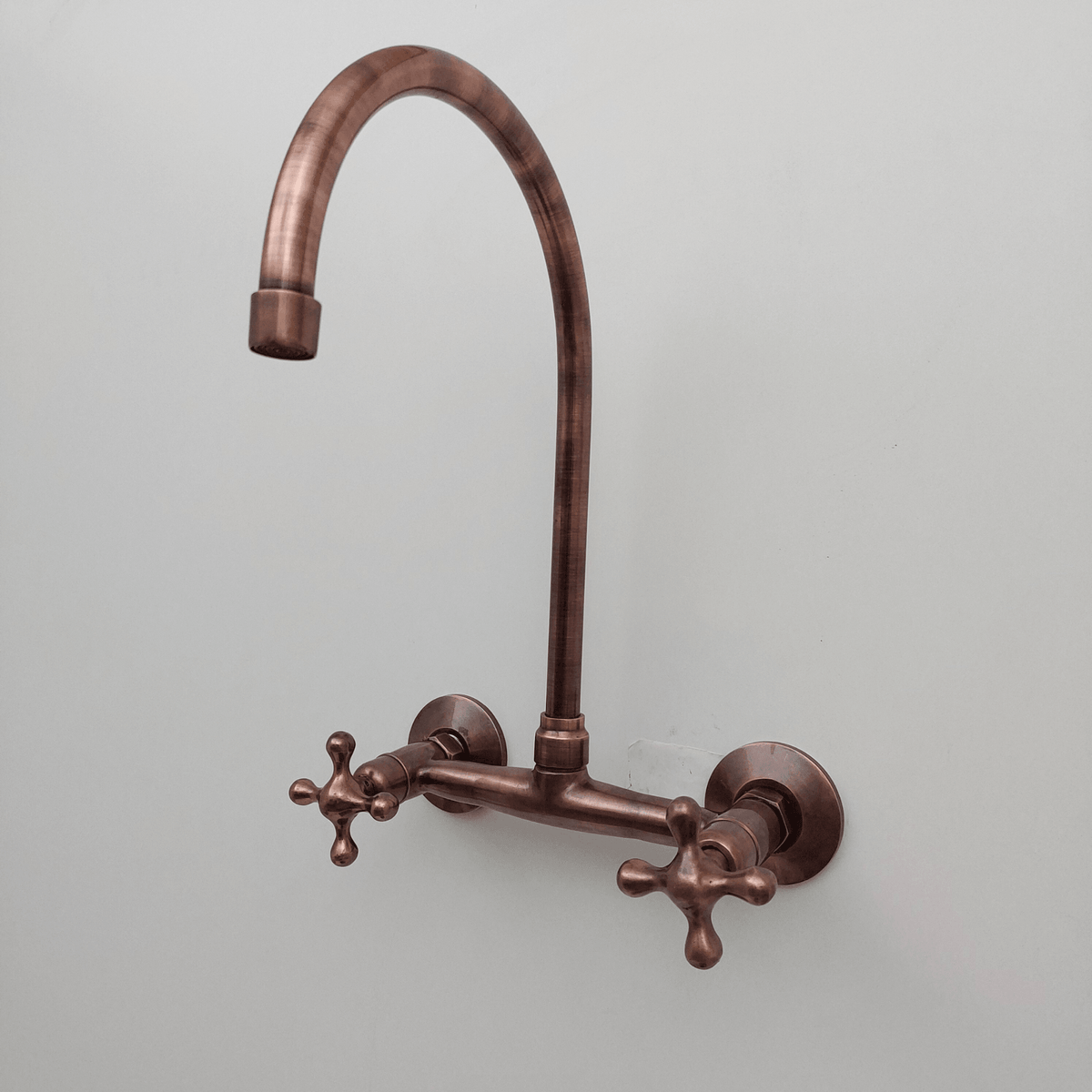 Antique copper wall-mounted kitchen faucet with cross handles