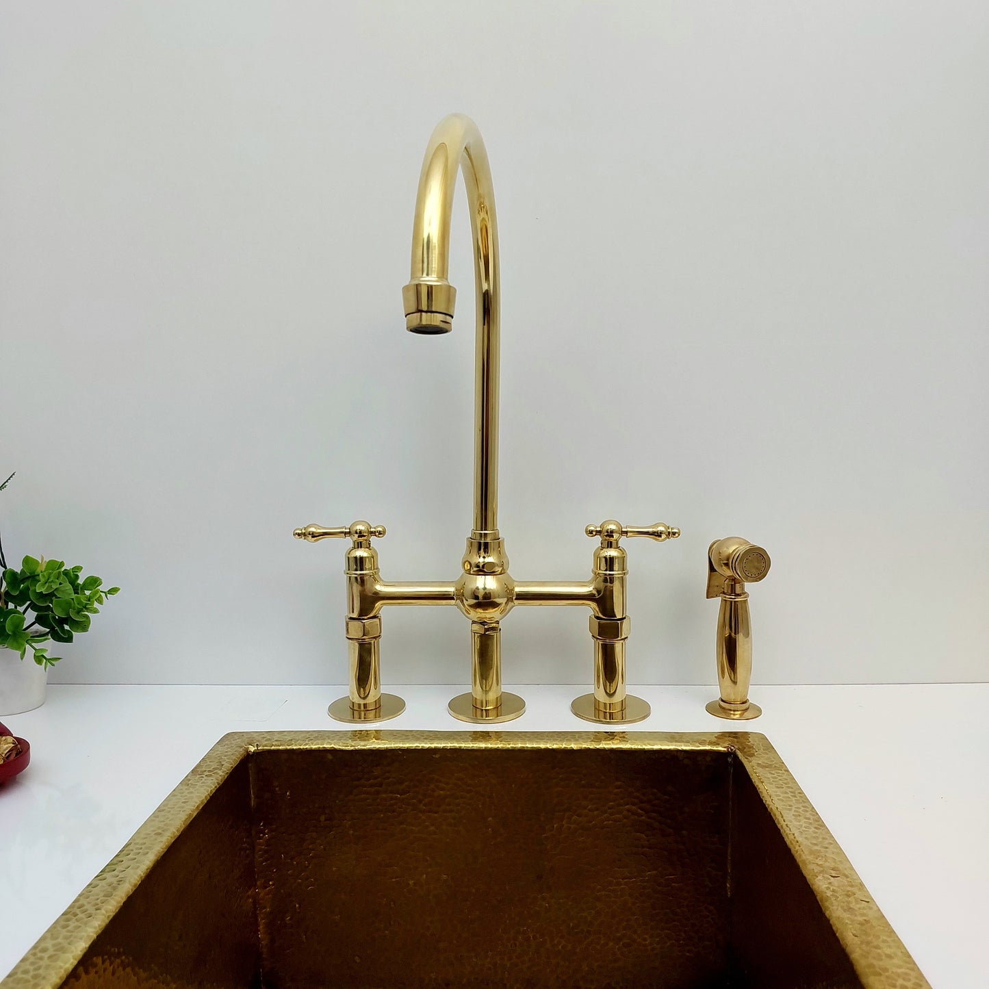 Unlacquered Brass Bridge Kitchen Faucet With Ball Center, 3 Straight Legs, And Sprayer - 8" Spread - Ref: AKC-4